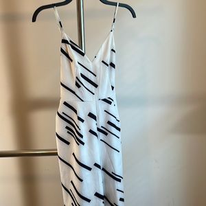 Women’s Jumpsuit. White. Medium. Never Worn. Waist tie. Zipper. Straps. NEW